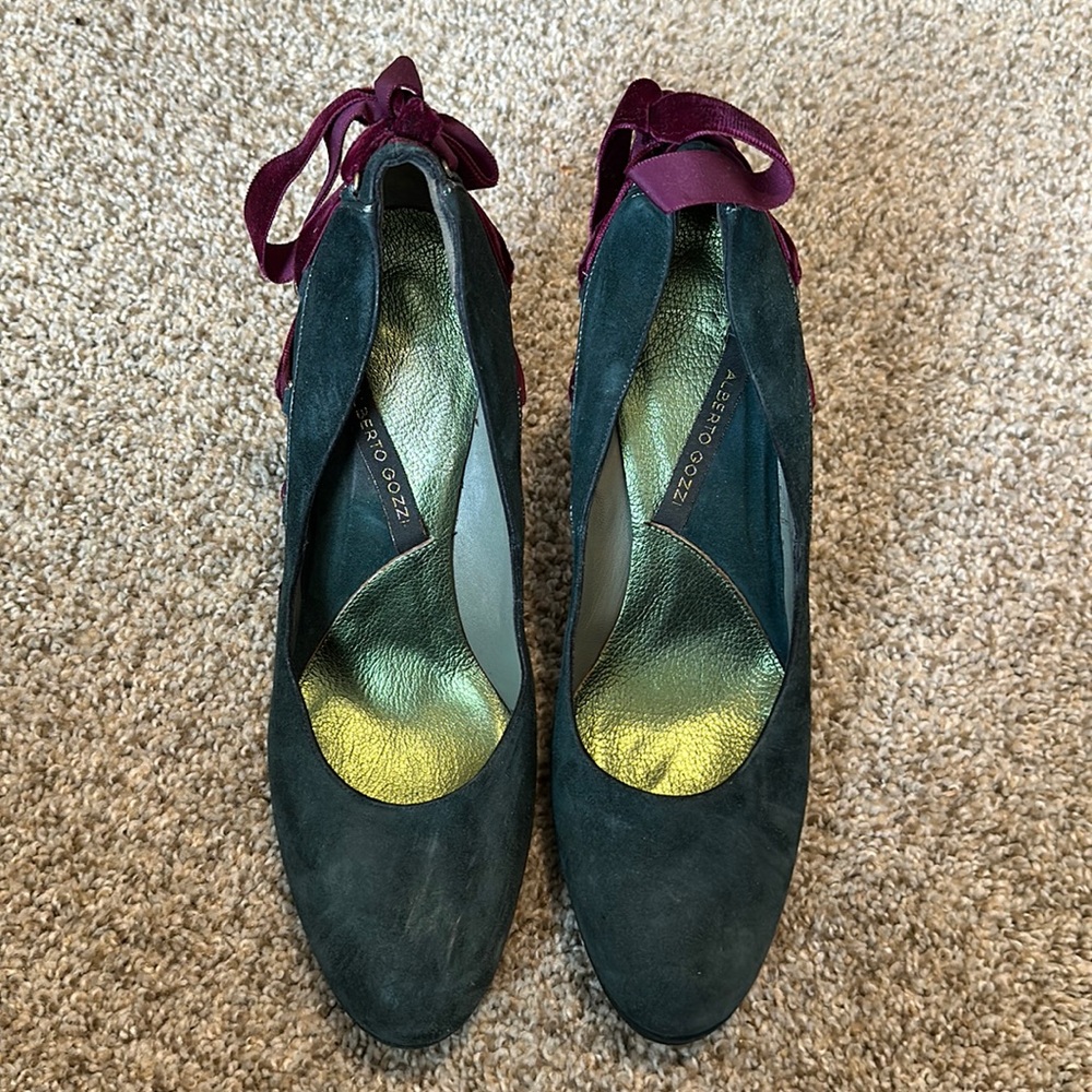 Turquoise pumps with purple suede ribbons on heel n under shoe